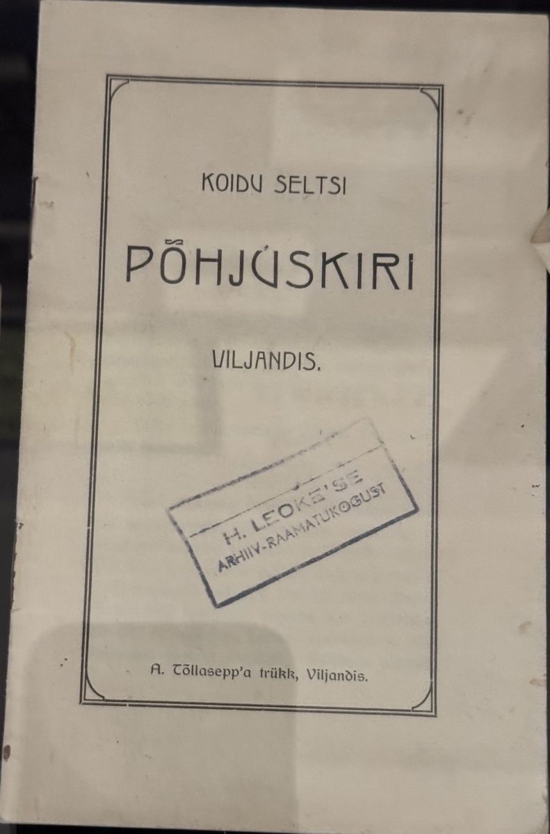 Printed booklet cover, “Koidu Seltsi Põhjuskiri, Viljandi”, with a rectangular archive-library stamp.